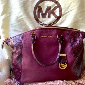 Large, authentic Michael Kors handbag.
